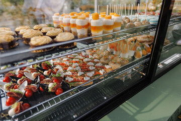 Vivid array of confections showcased enticingly on glass shelves