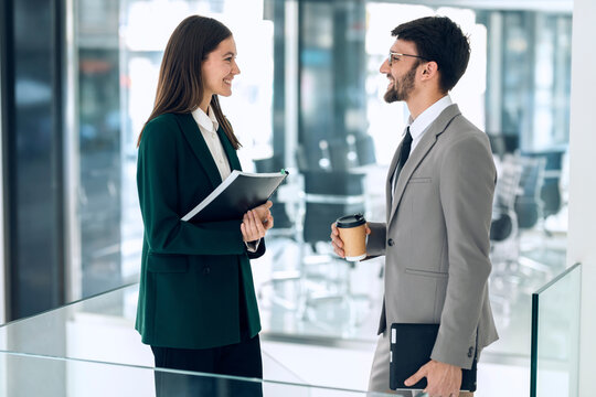 Business executives having a conversation in a modern office