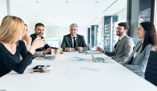 Business team having a discussion at conference table in modern office