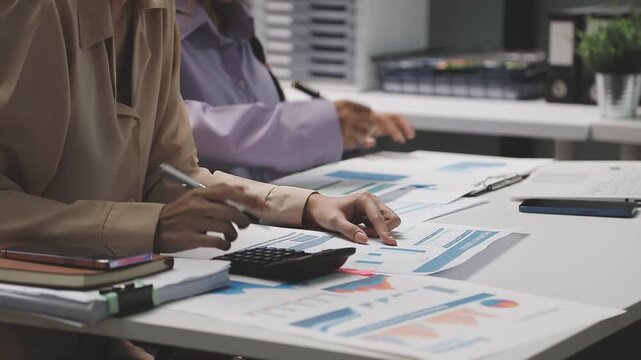 Finances Saving Economy concept. Female accountant or banker use calculator.