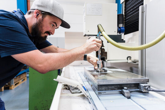 Man working at a machine in a factory