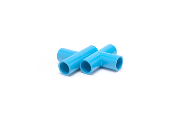 Blue PVC pipe T-joints arranged on white background for plumbing, isolated
