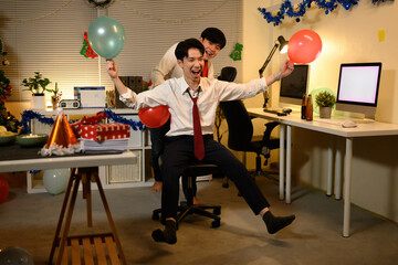 Holiday fun takes over the office with a spontaneous chair ride, festive laughter, and balloon-filled joy before the Christmas break