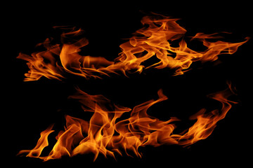 Fototapeta premium Blazing fire and glowing flames on a dark background perfect for creative design and visual effects. 
