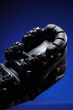 2025-11-03, Minsk, Belarus, dynamic sneaker sole with innovative design showcased against vibrant blue background