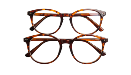 Two tortoise-shell eyeglasses stacked atop each other