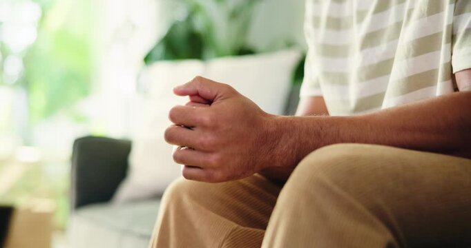 Counseling, hands and man on sofa with anxiety, overthinking or coping mechanism for nerves. Mental health, consultation and client in clinic for guidance, trauma help or recovery in reflection.