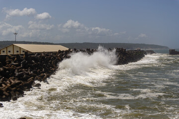Dramatic Waves Crashing Against Tetrapod Sea Wall