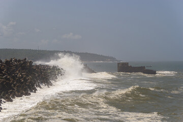 Dramatic Waves Crashing Against Tetrapod Sea Wall