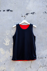 Stylish Reversible Black and Red Athletic Tank Top on Hanger Shows Sporty Style