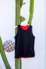 Stylish Black and Red Basketball Jersey on White Hanger With Basketball