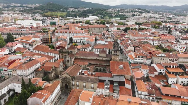 aerial view of s&eacute; de braga cathedral surrounded by old town rooftops in portugal