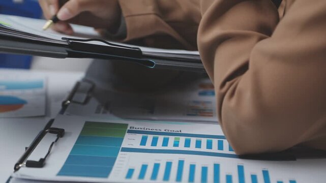 Finances Saving Economy concept. Female accountant or banker use calculator.