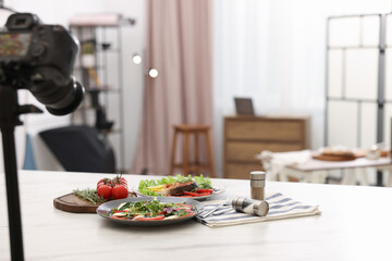 Shooting caprese salad at table in studio, closeup with space for text. Professional food photography
