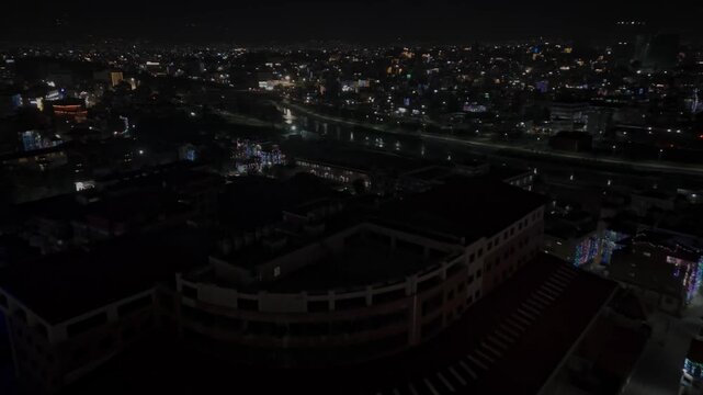 erial night footage of Kathmandu city during Diwali (Tihar), featuring the illuminated Dharahara Tower and glowing skyline filled with festive lights, showing Nepal&rsquo;s vibrant cultural celebration.