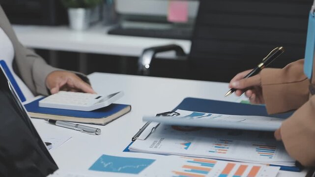 Finances Saving Economy concept. Female accountant or banker use calculator.