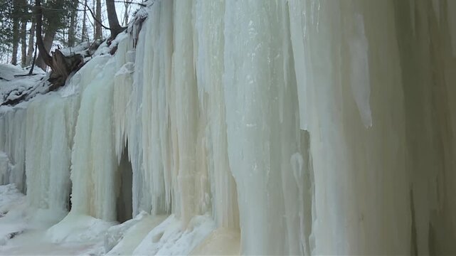 Closeup Of Ice Sheets In Eben Ice Caves In Michigan, USA. - tilt up shot