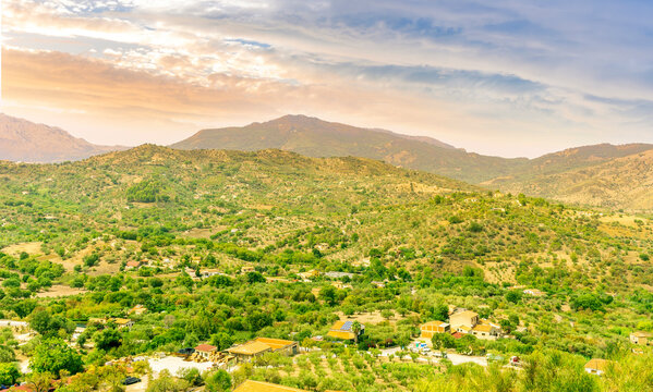 wonderful mountain landscape of great amazing mountains with greel slopes and hills and beautiful blue cloudy sky on background