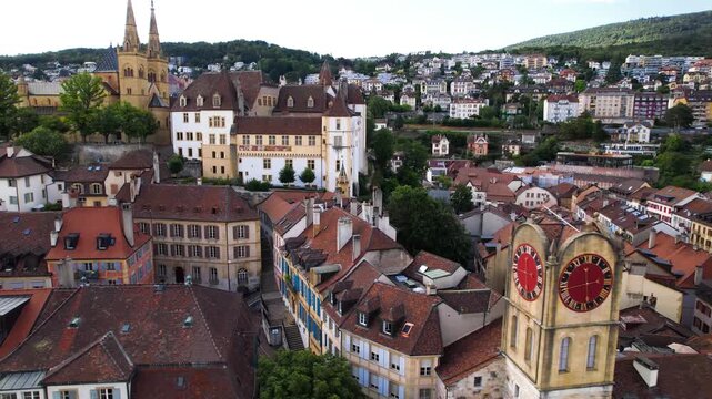Switzerland travel and scenic places. Aerial drone view of Neuchatel lake and charming town with impressive medieval castle. 4k hd aerial drone footage
