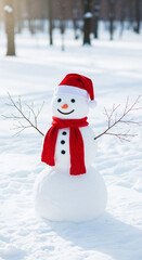 A cheerful snowman wearing a red hat and scarf stands in a snowy winter landscape