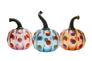 Three decorative glass pumpkins with colorful polka dots, isolated on transparent background