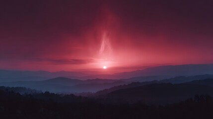 Naklejka premium Dramatic crimson sunset over layered mountain ranges with an ethereal glow