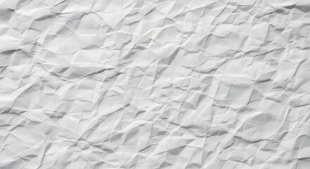 Obraz premium A close-up of a crumpled white paper sheet, showing the intricate folds, shadows, and texture.