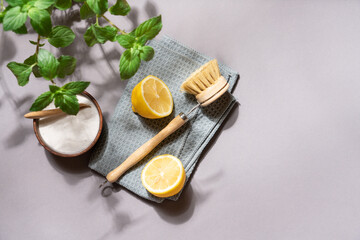 Zero waste cleaning concept with eco brushes and natural sponges on gray background, minimalist top view for sustainable lifestyle and home care design