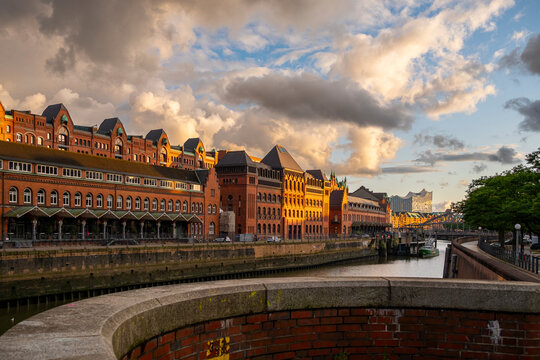 Speicherstadt Hamburg waterfront at sunset with historic brick architecture and canal reflections capturing the heritage cityscape and warm evening atmosphere