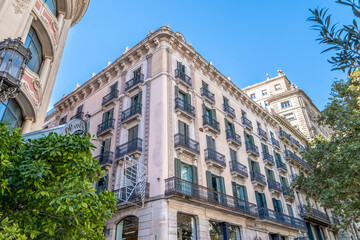 Historic Corner Building Facade with Balconies in Barcelona City Center