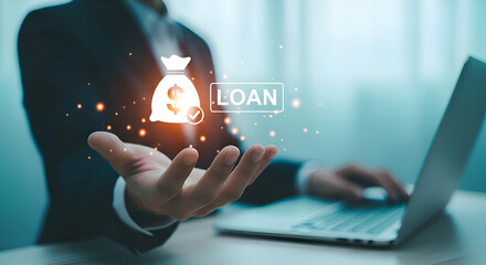 Business man using laptop with loan money bag icon on hand for application approval