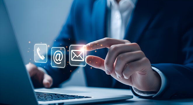 Businessman using a laptop to send email, phone and address contact us concept, customer service
