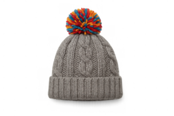 Gray cable knit wool hat with colorful pom-pom isolated on transparent background, winter clothing accessory