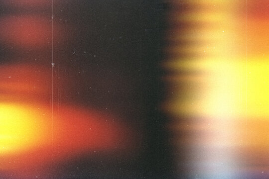 light leak overlay effect with scratch dust and blur yellow light leaks,retro noisy film texture light leak flare on black background,abstract background with colorful light,grunge old film burn ray