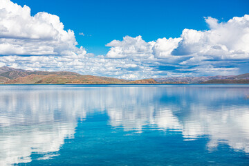 Yamdrok Lake Mirror Reflections of Blue Sky and White Clouds