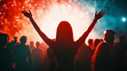 Crowd of people watching fireworks. Silhouettes of people watching fireworks at night. People put their hands in the air and having fun watching the fireworks. Festival, New Year celebration - Powered by Adobe