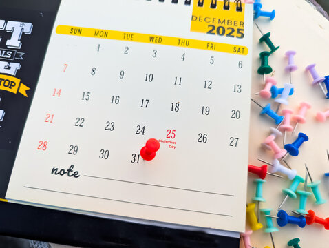 31st december marked with push pin on calendar 2025