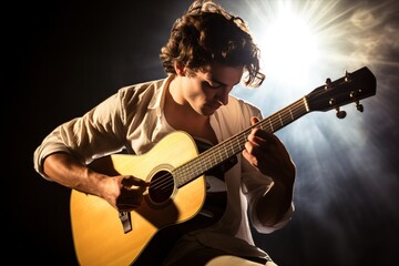 Obraz premium Musician performing on acoustic guitar at a concert, stage lights