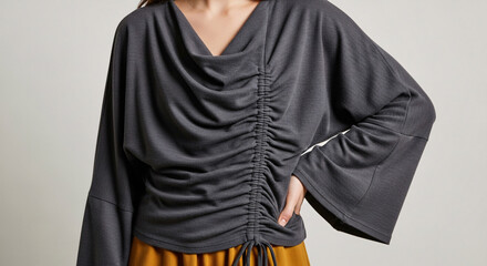 Chic charcoal grey draped ruched blouse with wide sleeves and adjustable drawstring detail