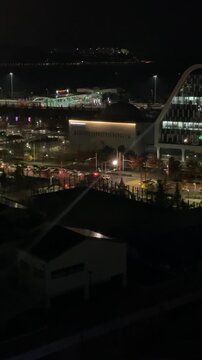 Night view of urban cityscape in Busan, South Korea &ndash; quiet residential neighborhood seen from apartment window with city lights
