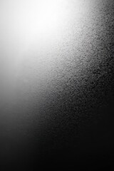 Glittering Silver Dust Particles on Black Background with Soft Gradient Light and Sparkling Effect