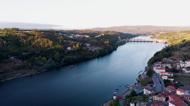 aerial view of crestuma on the gaia side, where the douro river winds between green hills and red rooftops
