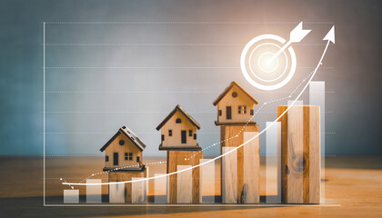 Wooden house model on the increasing bar graph with arrow and target icon