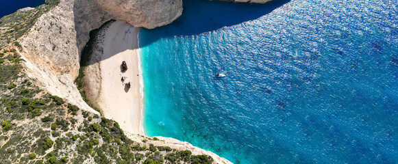 Aerial drone ultra wide photo of one of the most photographed beaches in the world called navagio or shipwreck a ship rest to rust ashore vanishing through the years, Zakinthos island, Ionian, Greece