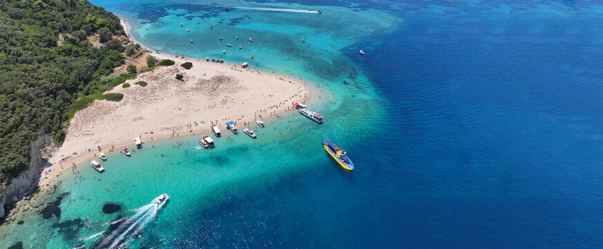 Aerial drone ultra wide panoramic photo of scenic small paradise island of Marathonisi or Turtle island in bay of Laganas where Caretta Caretta turtle eggs hatch, Zakynthos island, Ionian, Greece