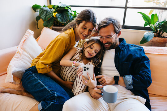 Family moments on the couch with a phone