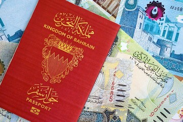Bahraini dinar currency money bills and passport close up. The concept of travel and vacation
