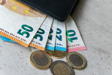 Leather partmone with money, euro coins and bills. Business concept.