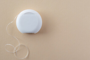 Teeths Flossing. Oral hygiene and health care. Dental floss on the blue background for white healthy teeth.