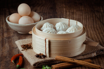 Traditional Xiaolongbao Soup Dumplings In Rustic Setting